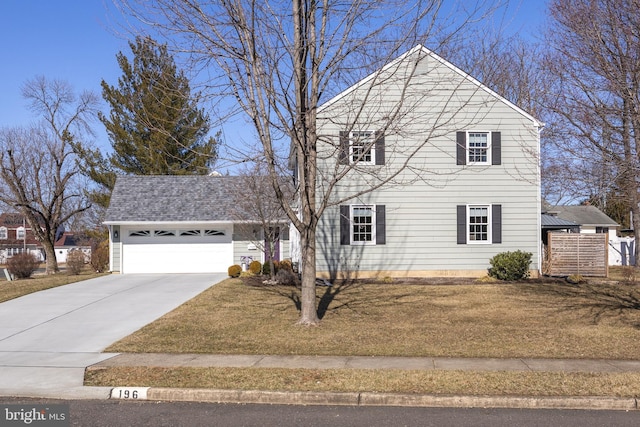 traditional home featuring a shingled roof, a front yard, driveway, and an attached garage