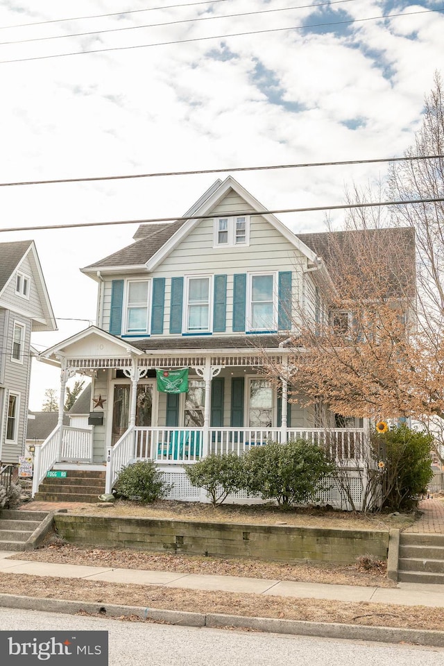 view of front of property featuring covered porch