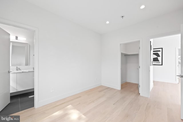 4810 3rd St N, Arlington, VA 22203 - unfurnished bedroom featuring a walk in closet, wood finished floors, recessed lighting, a closet, and connected bathroom