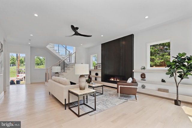 4810 3rd St N, Arlington, VA 22203 - living room with healthy amount of natural light, stairway, light wood-style flooring, recessed lighting, and a large fireplace