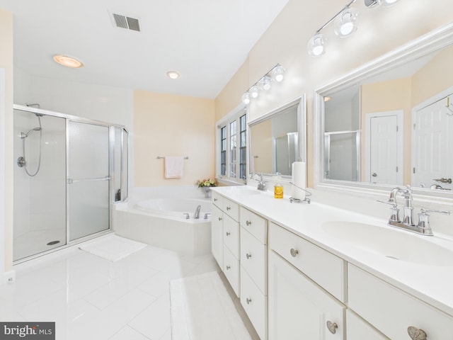 bathroom with double vanity, visible vents, a sink, a shower stall, and a bath