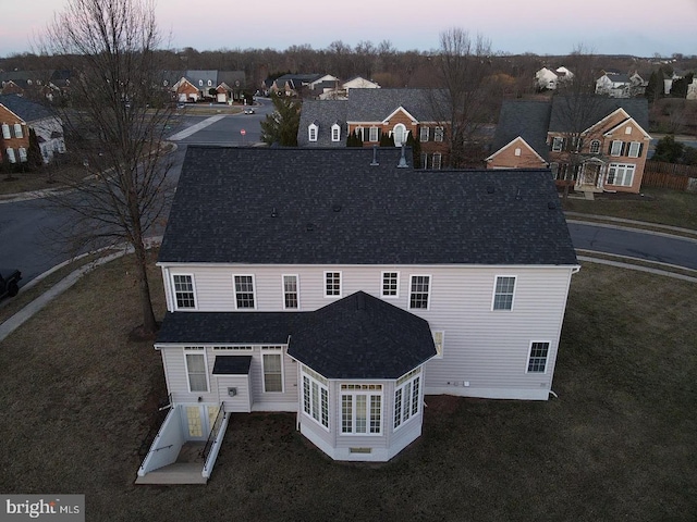 aerial view at dusk with a residential view