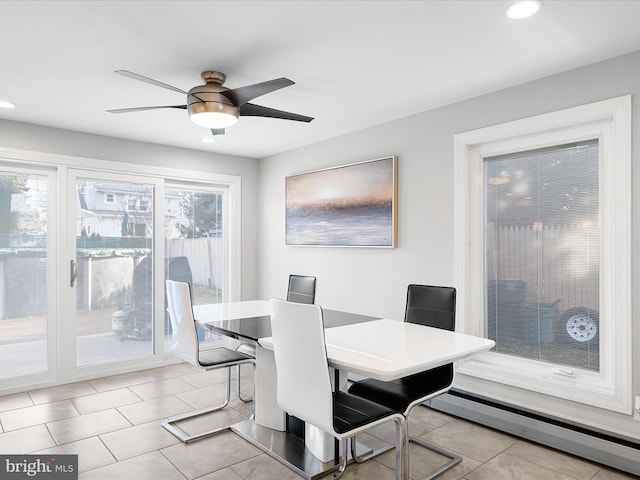 tiled dining space featuring a baseboard radiator, ceiling fan, and recessed lighting