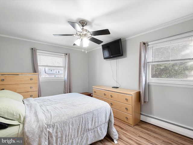 bedroom featuring multiple windows, a baseboard radiator, and crown molding