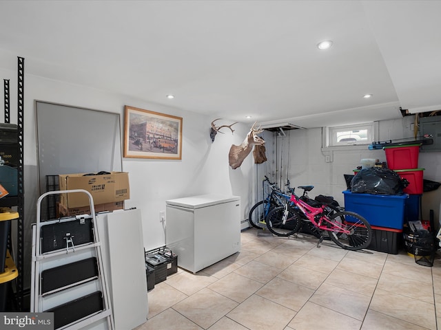 laundry room featuring light tile patterned floors and recessed lighting