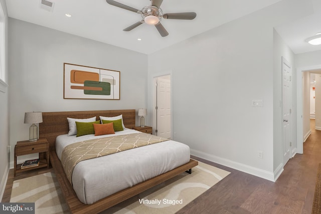 bedroom with ceiling fan, recessed lighting, wood finished floors, visible vents, and baseboards