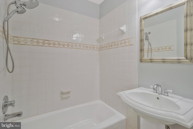 bathroom featuring a sink and bathing tub / shower combination