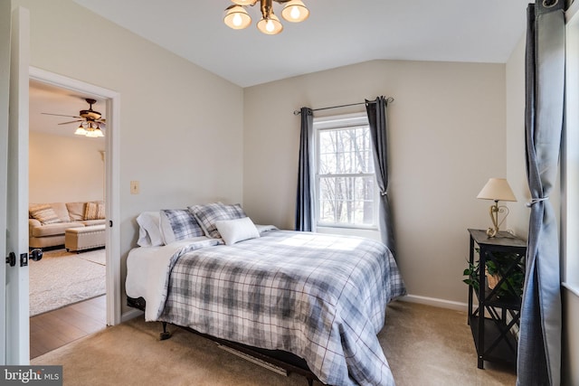 bedroom featuring a notable chandelier, carpet flooring, baseboards, and vaulted ceiling