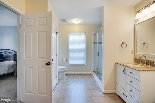 full bath with vanity, baseboards, visible vents, a stall shower, and toilet