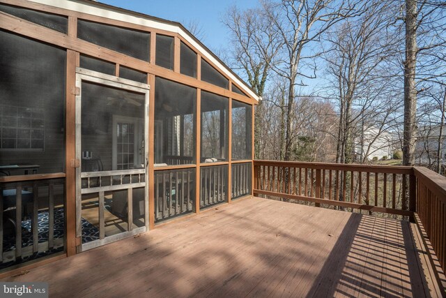 wooden deck featuring a sunroom