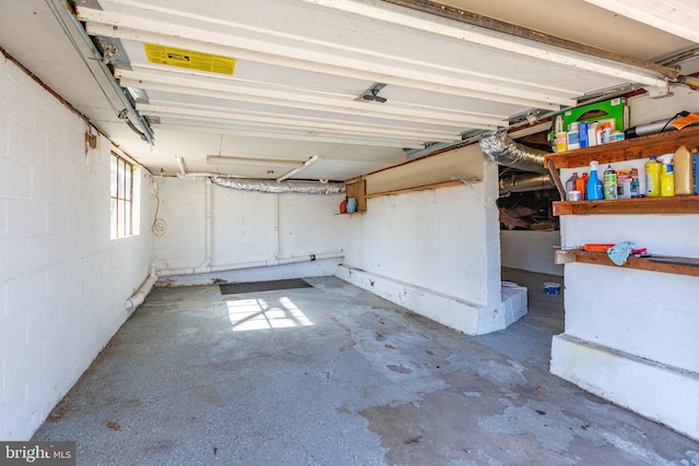 garage featuring concrete block wall