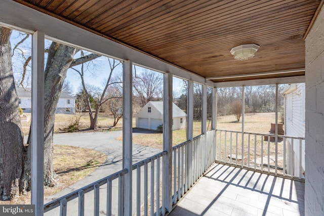 unfurnished sunroom featuring wooden ceiling