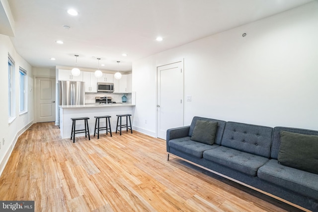 5664 Gainor Rd, Philadelphia, PA 19131 - living area featuring light wood-style floors, baseboards, and recessed lighting
