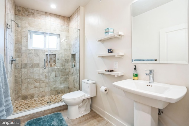 5664 Gainor Rd, Philadelphia, PA 19131 - full bathroom featuring toilet, a shower stall, baseboards, and a sink