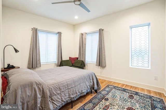 5664 Gainor Rd, Philadelphia, PA 19131 - bedroom featuring a ceiling fan, multiple windows, baseboards, and wood finished floors