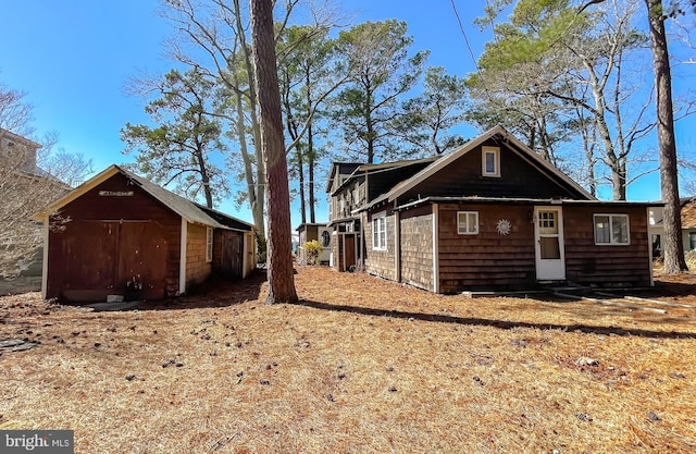 view of home's exterior featuring an outbuilding