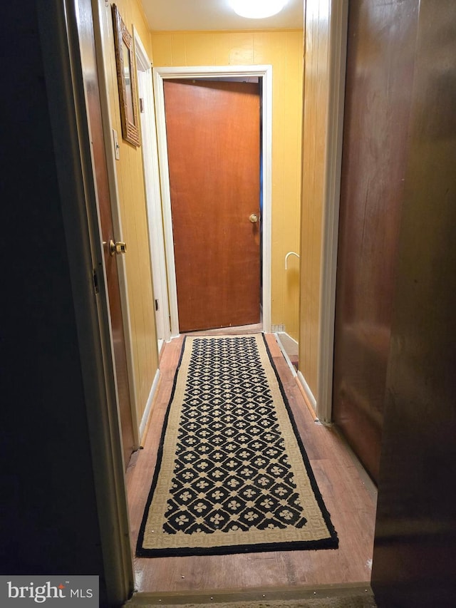 corridor with wood finished floors