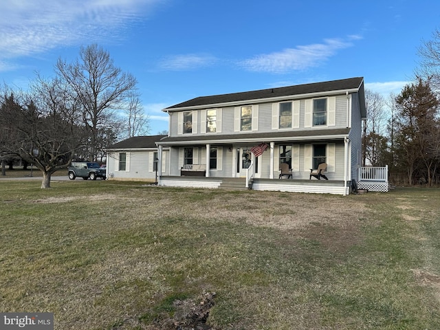 view of front of house with covered porch and a front lawn