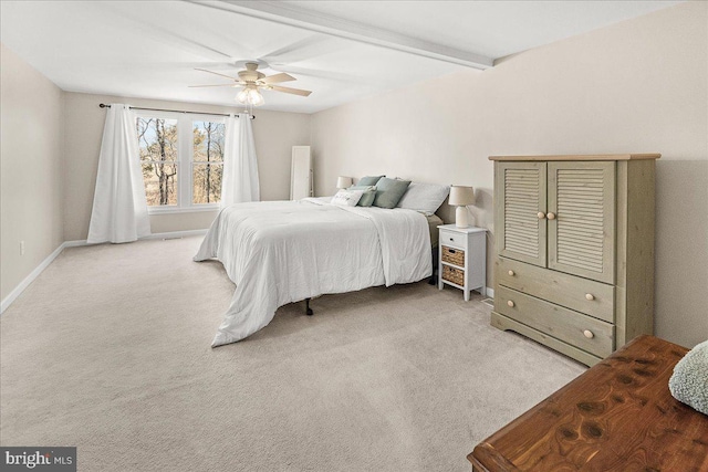 bedroom with carpet flooring, beamed ceiling, baseboards, and ceiling fan