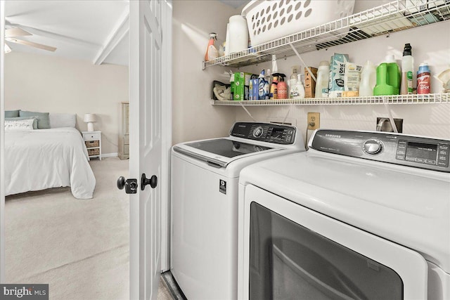 laundry room with separate washer and dryer and carpet