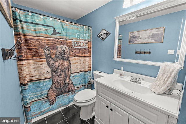 bathroom featuring tile patterned flooring, a shower with shower curtain, toilet, and vanity