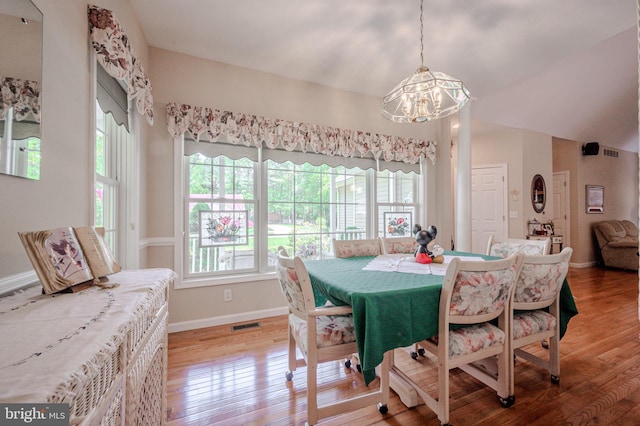 17024 Turtle Hl, Milford, DE 19963 - dining area featuring light wood-style floors, baseboards, visible vents, and a notable chandelier