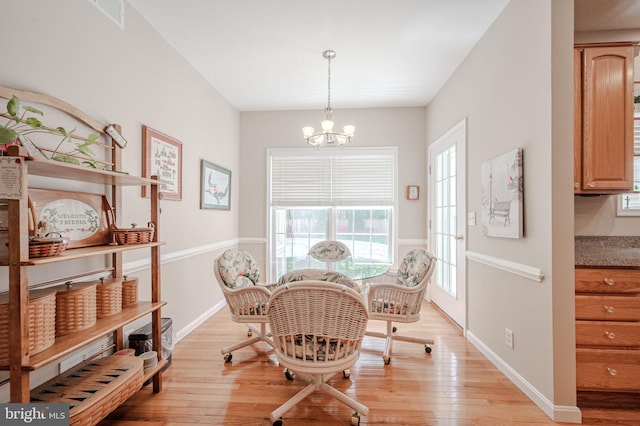 17024 Turtle Hl, Milford, DE 19963 - dining room with baseboards, light wood-style flooring, a notable chandelier, and visible vents