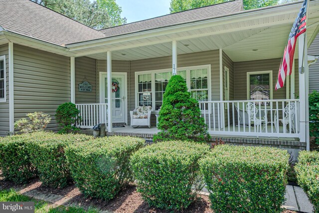 17024 Turtle Hl, Milford, DE 19963 - entrance to property featuring a porch and a shingled roof