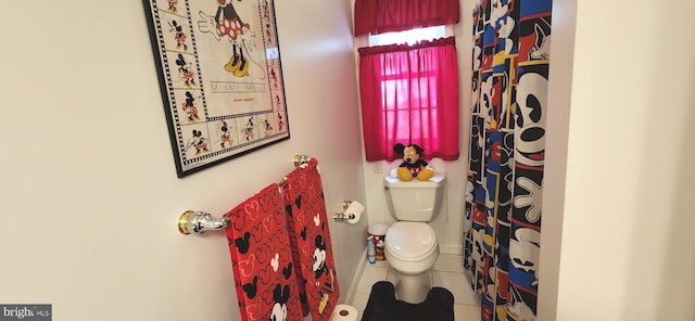 17024 Turtle Hl, Milford, DE 19963 - bathroom with tile patterned floors, toilet, and a shower with curtain