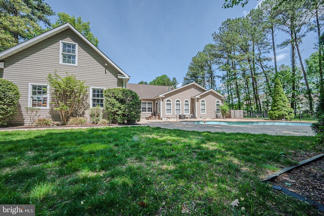 17024 Turtle Hl, Milford, DE 19963 - view of front of home featuring a fenced in pool, fence, and a front lawn