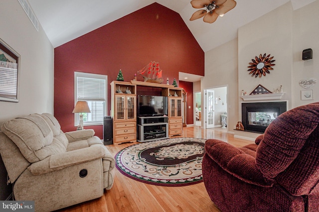 17024 Turtle Hl, Milford, DE 19963 - living area with visible vents, light wood-style floors, ceiling fan, and high vaulted ceiling