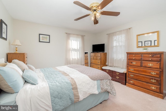 carpeted bedroom with a ceiling fan