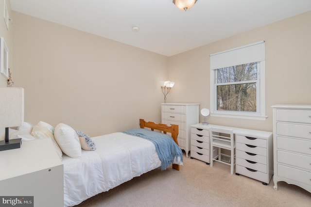 bedroom with light colored carpet