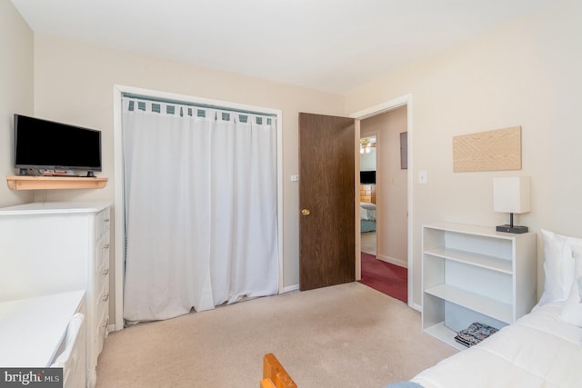 bedroom featuring light colored carpet