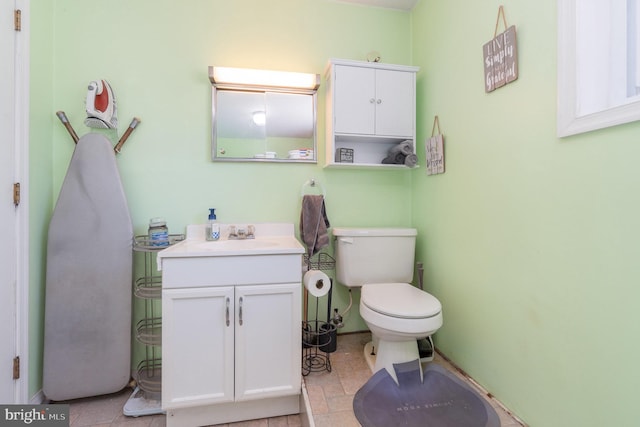 bathroom featuring toilet and vanity