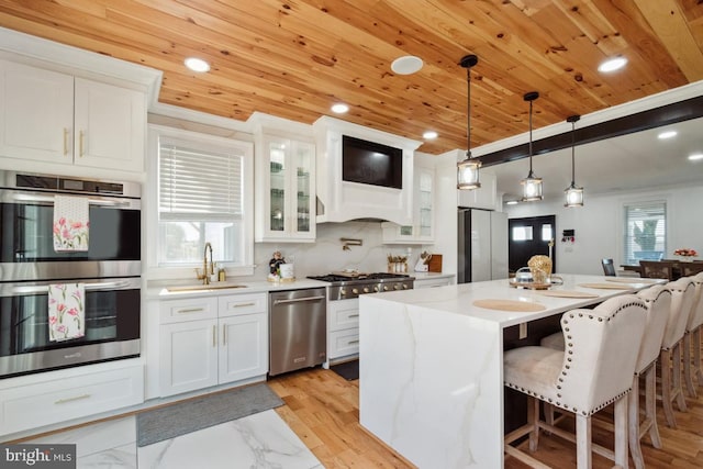 3524 Blenheim Rd, Phoenix, MD 21131 - kitchen with wood ceiling, white cabinets, stainless steel appliances, and a sink