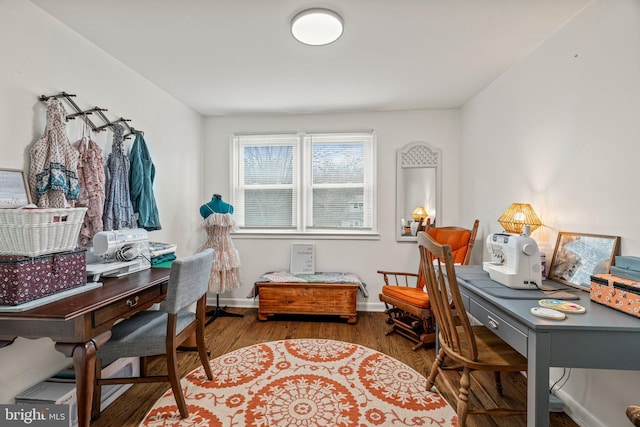 office space with baseboards and wood finished floors