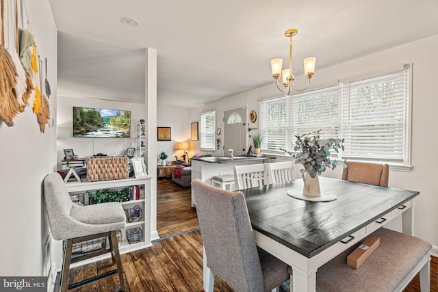 dining room with an inviting chandelier and wood finished floors