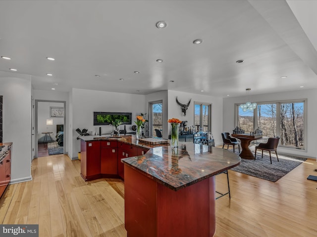 kitchen featuring light wood-type flooring, a wealth of natural light, and recessed lighting