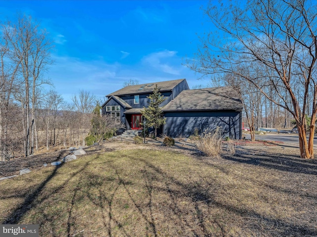 view of front of home with a front yard