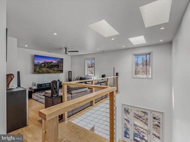 dining area with light wood finished floors, a ceiling fan, and recessed lighting