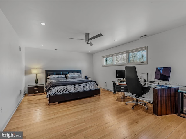 bedroom with hardwood / wood-style floors, a ceiling fan, visible vents, and recessed lighting