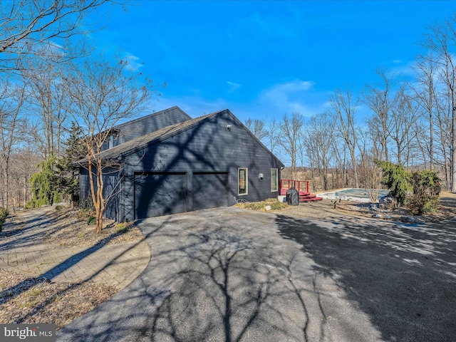 view of side of property with driveway