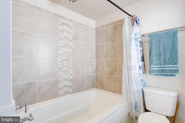 full bathroom featuring shower / bath combo and toilet