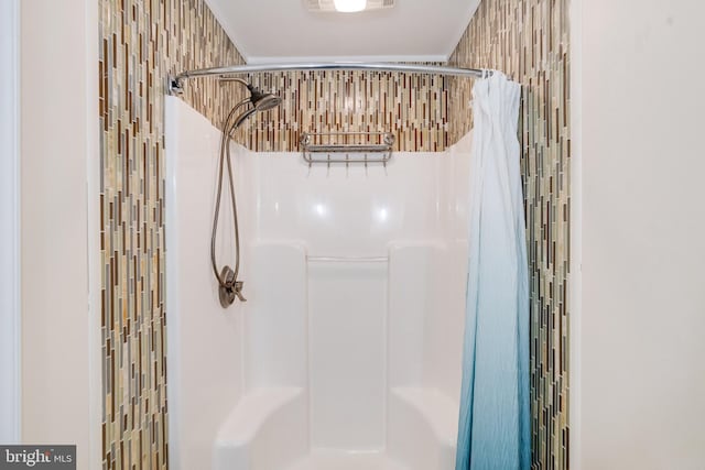 full bathroom featuring a stall shower