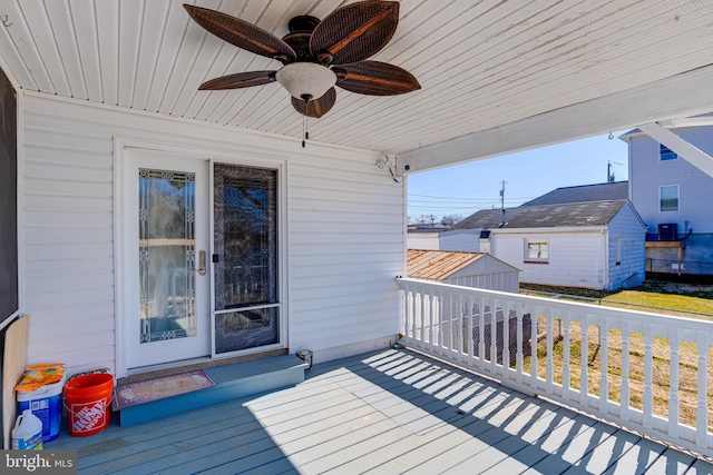 wooden deck with ceiling fan and central air condition unit