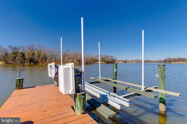 view of dock featuring a water view and boat lift