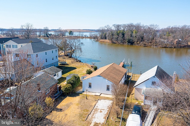 drone / aerial view featuring a residential view and a water view