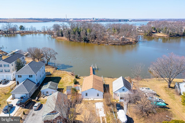 drone / aerial view with a residential view and a water view