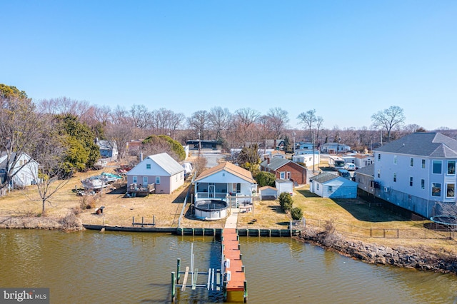 bird's eye view featuring a water view and a residential view